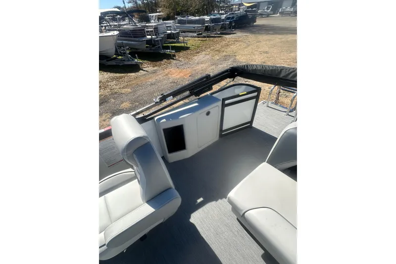 Slide: The Image of 2026 Godfrey Sweetwater 2286 Cruise Special Edition interior with seating and storage. - 12