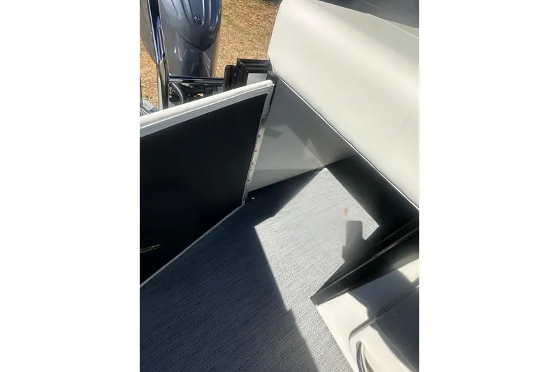 Slide: The Image of 2026 Godfrey Sweetwater 2286 Cruise Special Edition interior with open door and flooring. - 16