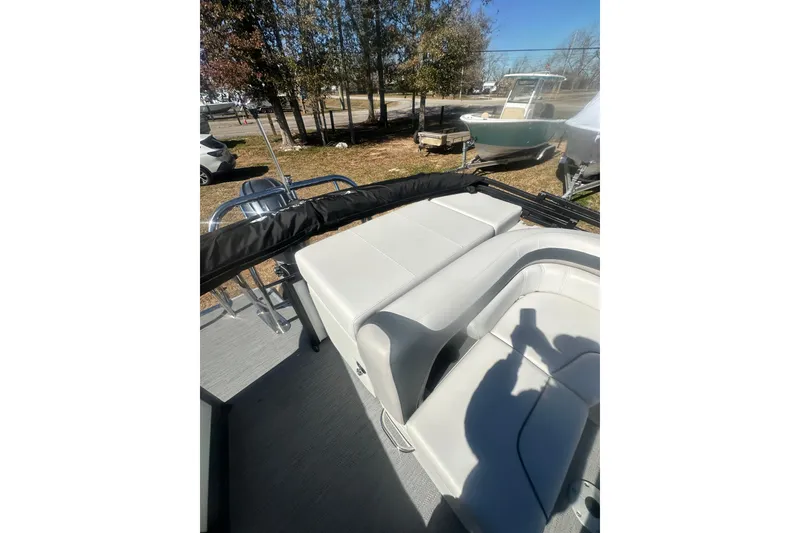 Slide: The Image of 2026 Godfrey Sweetwater 2286 Cruise Special Edition boat interior with seating and outdoor view. - 18