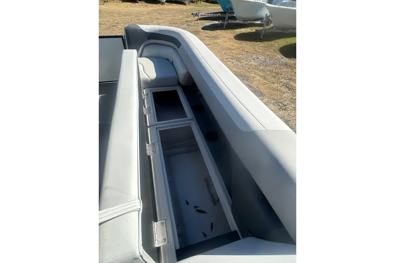 Slide: The Image of 2026 Godfrey Sweetwater 2286 Cruise Special Edition boat interior with open storage compartment. - 22