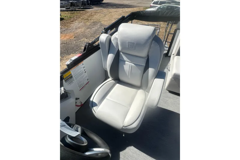 Slide: The Image of 2026 Godfrey Sweetwater 2286 Cruise Special Edition boat seat, white leather, outdoor setting. - 23