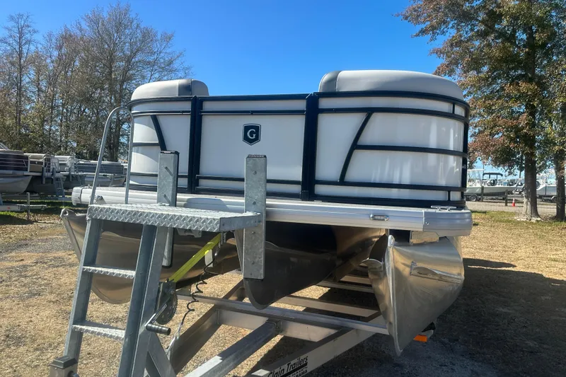 Slide: The Image of 2026 Godfrey Sweetwater 2286 Cruise Special Edition pontoon boat on trailer, outdoors. - 6