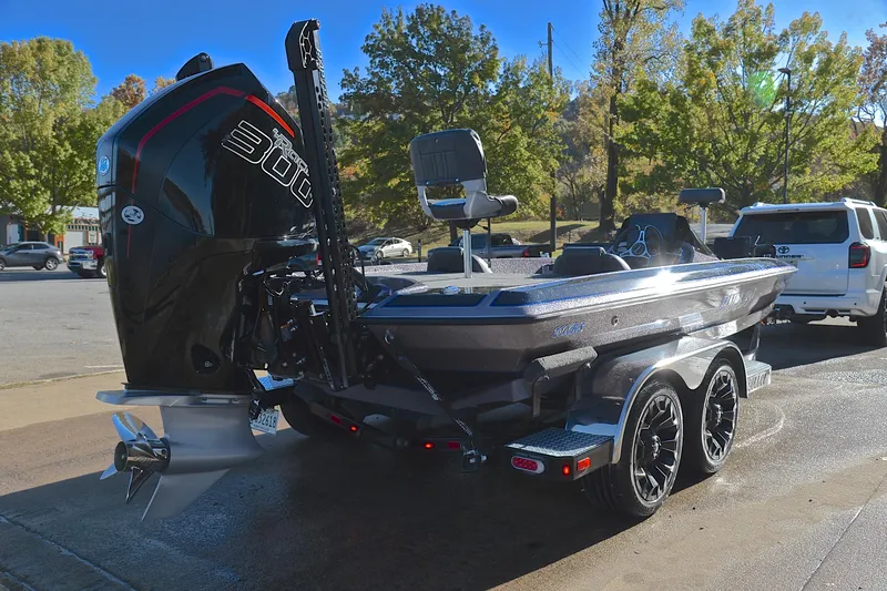 Slide: The Image of 2023 Bullet 21XRS boat with powerful engine, parked outdoors on a sunny day. - 14