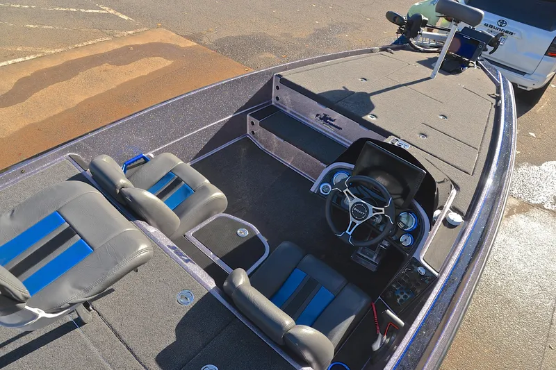 Slide: The Image of 2023 Bullet 21XRS boat interior with dual seats and steering console. - 20