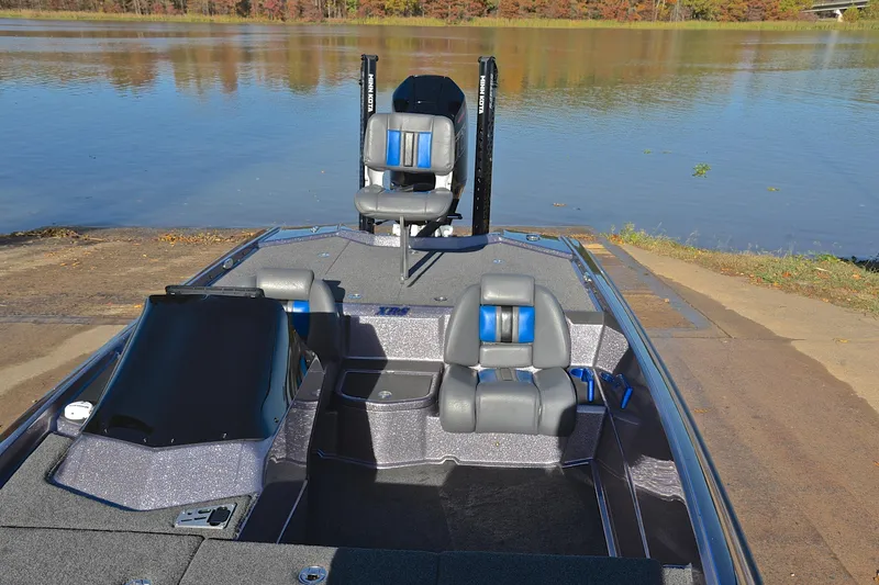 Slide: The Image of 2023 Bullet 21XRS boat at a lakeside launch, featuring sleek seating and modern design. - 22