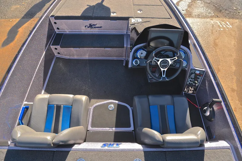 Slide: The Image of 2023 Bullet 21XRS boat interior with steering wheel and dual seats. - 24