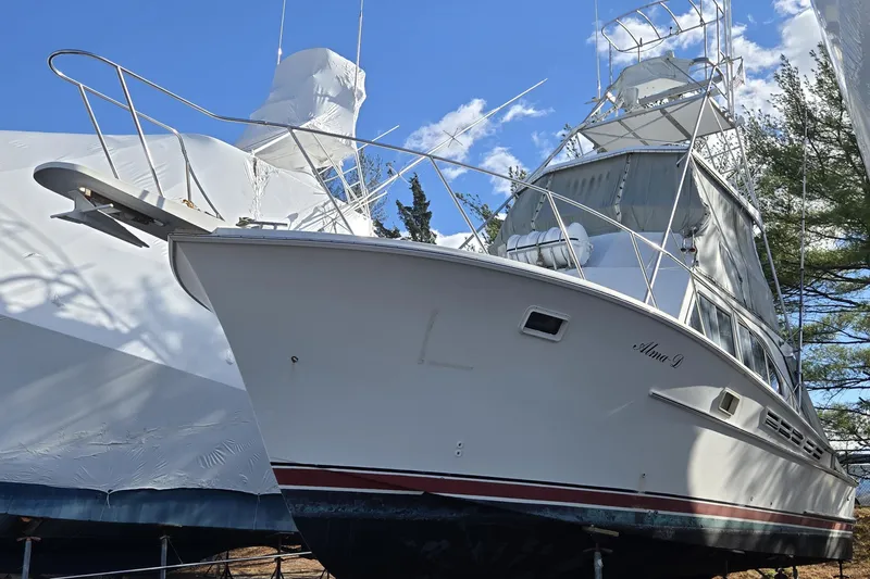 Slide: The Image of 1980 Jersey 40FT Convertible boat docked, featuring sleek design and sturdy build. - 15