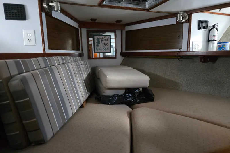 Slide: The Image of Interior of a 1980 Jersey 40FT Convertible boat with seating and decor. - 19
