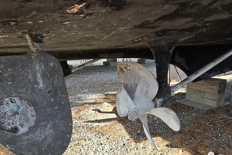 Slide: The Image of Underside view of a 1980 Jersey 40FT Convertible boat with visible propeller. - 32