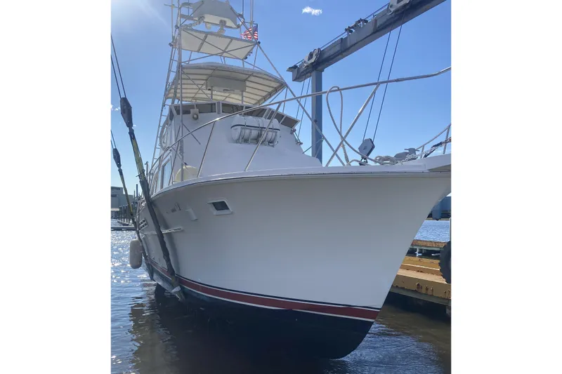 Slide: The Image of 1980 Jersey 40FT Convertible boat docked, showcasing sleek design and sturdy build. - 38