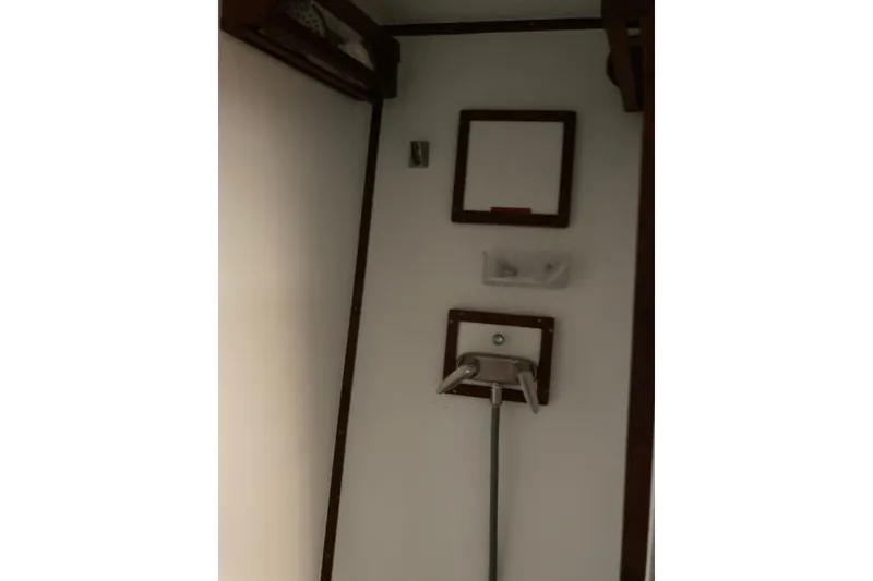 Slide: The Image of Interior of 1980 Jersey 40FT Convertible boat shower area with fixtures. - 47