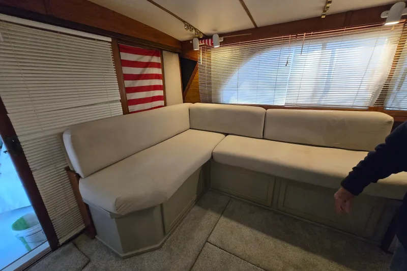Slide: The Image of Interior of 1980 Jersey 40FT Convertible with beige sofa and American flag decor. - 6