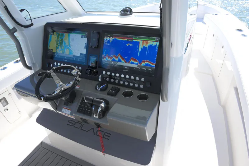 Slide: The Image of 2025 Solace 37 CS boat dashboard with advanced navigation and control systems. - 7