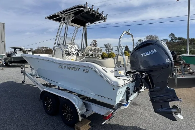 The Image of 2026 Key West 203 FS boat with Yamaha outboard engine on a trailer. - 1