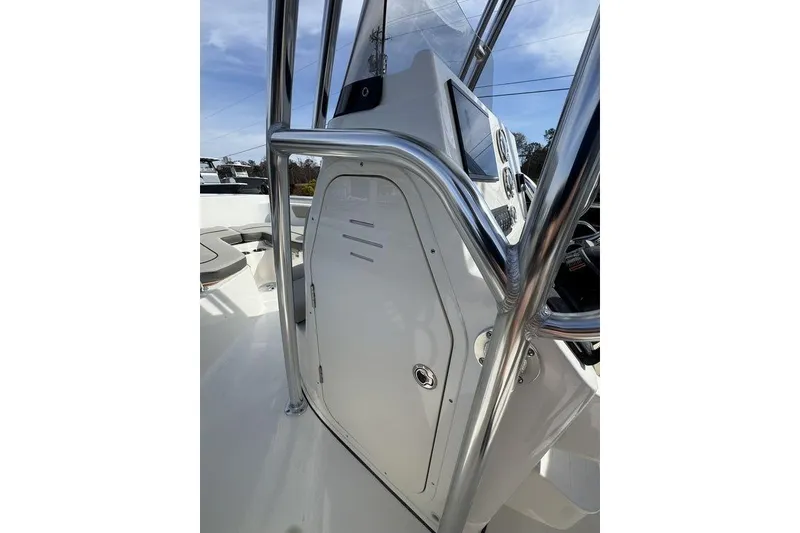 Slide: The Image of 2026 Key West 203 FS boat console with stainless steel railings and control panel. - 18