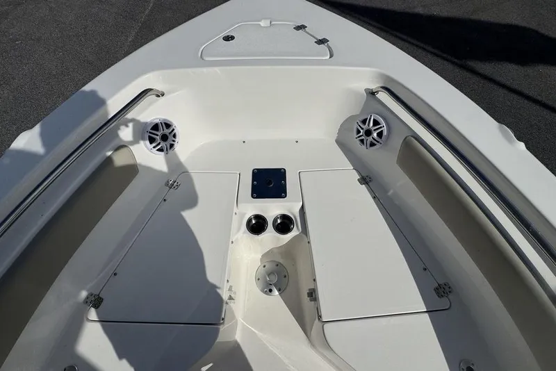 Slide: The Image of Bow seating area of 2026 Key West 203 FS boat with speakers and storage compartments. - 22