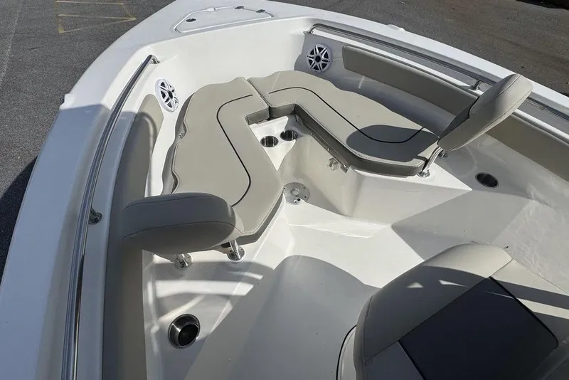 Slide: The Image of 2026 Key West 203 FS boat interior with cushioned seating and speakers. - 23