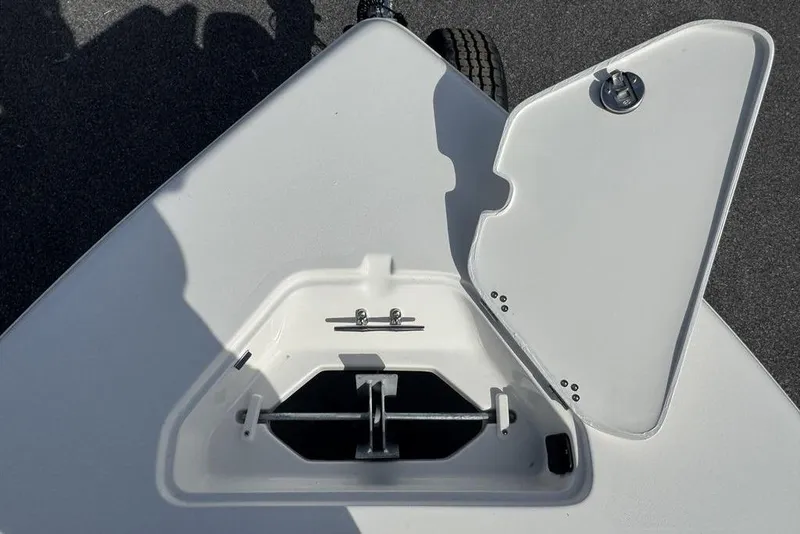Slide: The Image of Open anchor compartment on 2026 Key West 203 FS boat, showing storage details. - 26