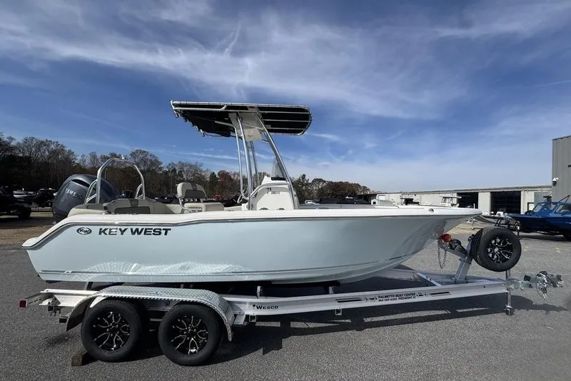 Slide: The Image of 2026 Key West 203 FS boat on trailer under clear blue sky. - 3