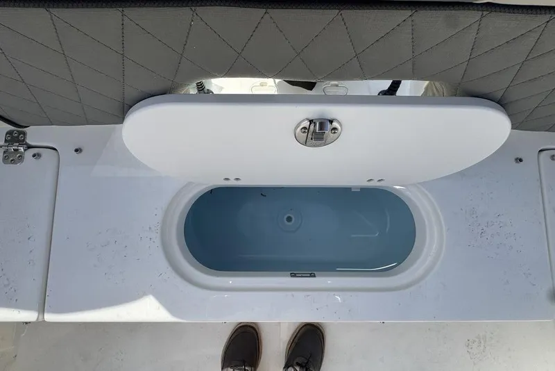 Slide: The Image of Livewell compartment on 2026 Key West 203 FS boat, open lid view. - 7