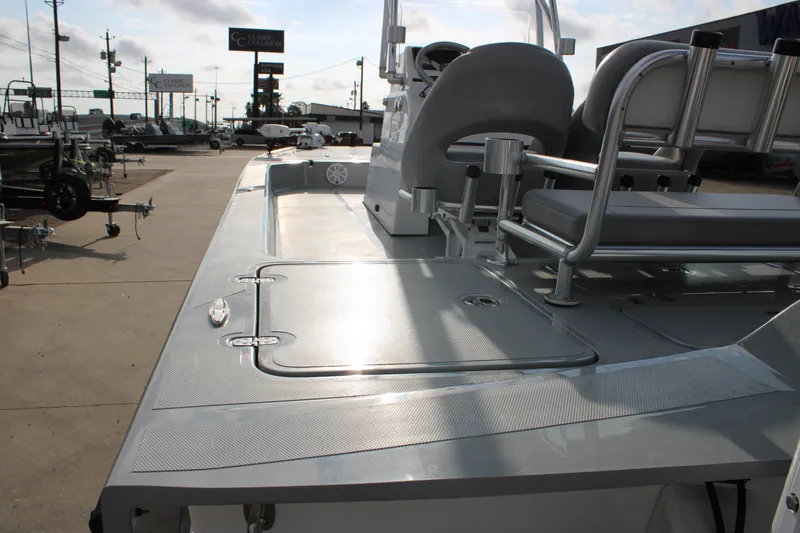 Slide: The Image of 2026 Mamba 24 Cat Elite boat deck with seating and storage compartments. - 10