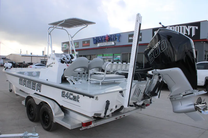 Slide: The Image of 2026 Mamba 24 Cat Elite boat with Mercury 300 engine on trailer. - 11