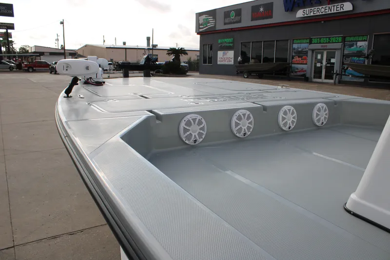 Slide: The Image of 2026 Mamba 24 Cat Elite boat with speakers, displayed at a marine supercenter. - 3