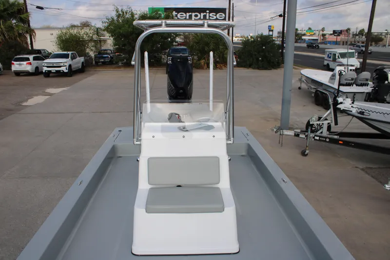 Slide: The Image of 2026 Mamba 24 Cat Elite boat with sleek design and modern features, parked outdoors. - 4