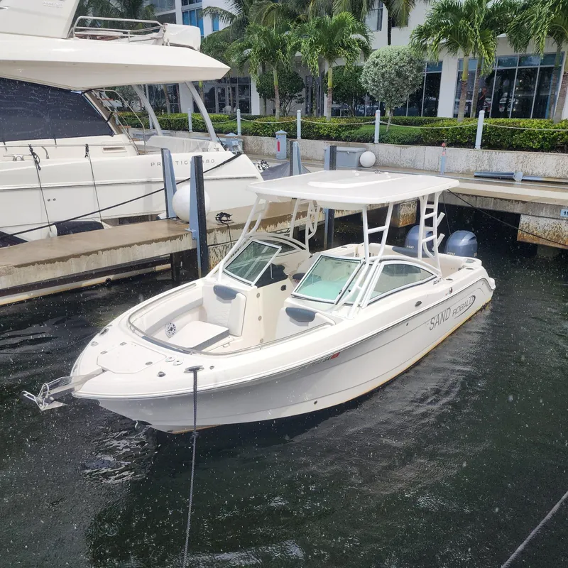 Slide: The Image of 2021 Robalo R247 Dual Console boat docked in marina. - 5