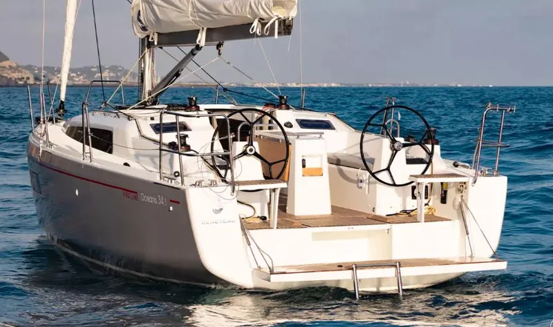 The Image of 2024 Beneteau Oceanis 34.1 sailboat on open water, rear view. - 0