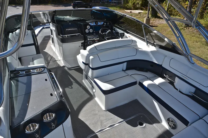 Slide: The Image of 2016 Formula 350 Crossover Bowrider interior with luxurious seating and modern dashboard. - 20