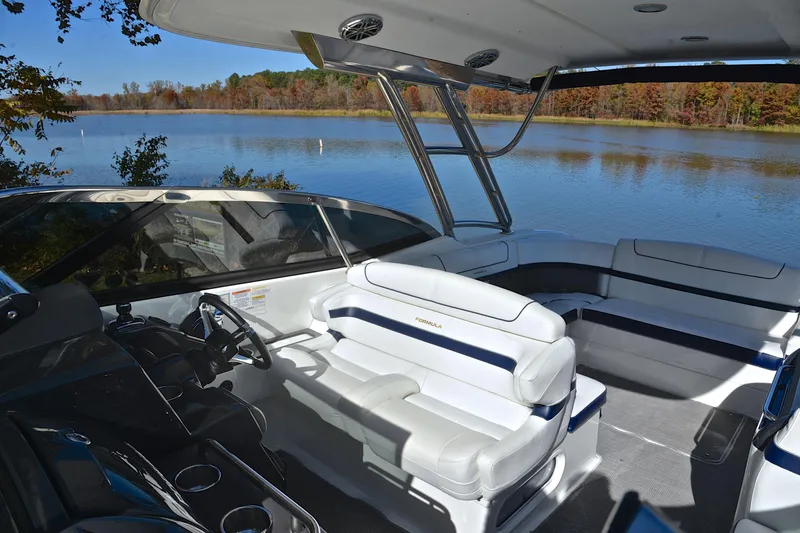 Slide: The Image of 2016 Formula 350 Crossover Bowrider interior with lake view, featuring luxurious seating. - 24