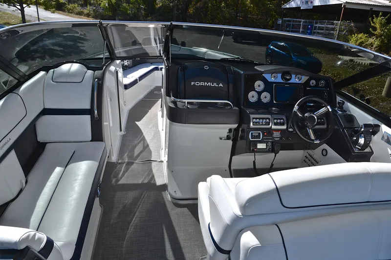 Slide: The Image of 2016 Formula 350 Crossover Bowrider interior with sleek dashboard and luxurious seating. - 28