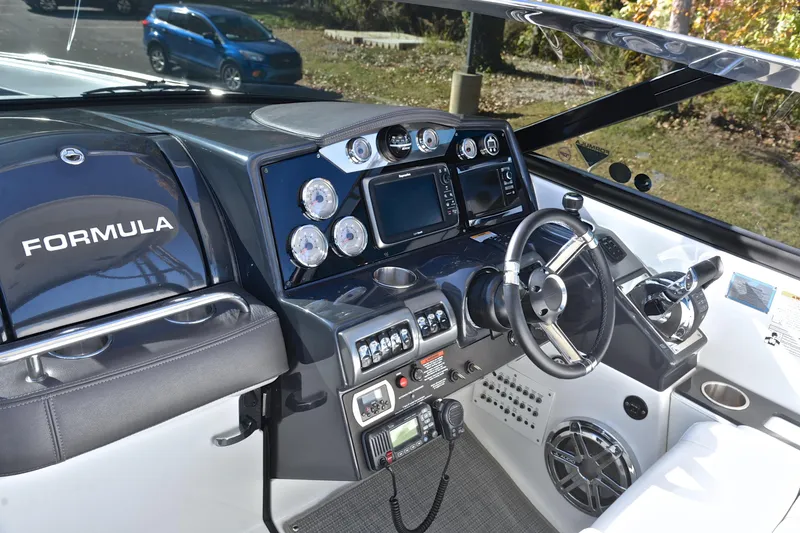 Slide: The Image of 2016 Formula 350 Crossover Bowrider dashboard with steering wheel and control panel. - 29