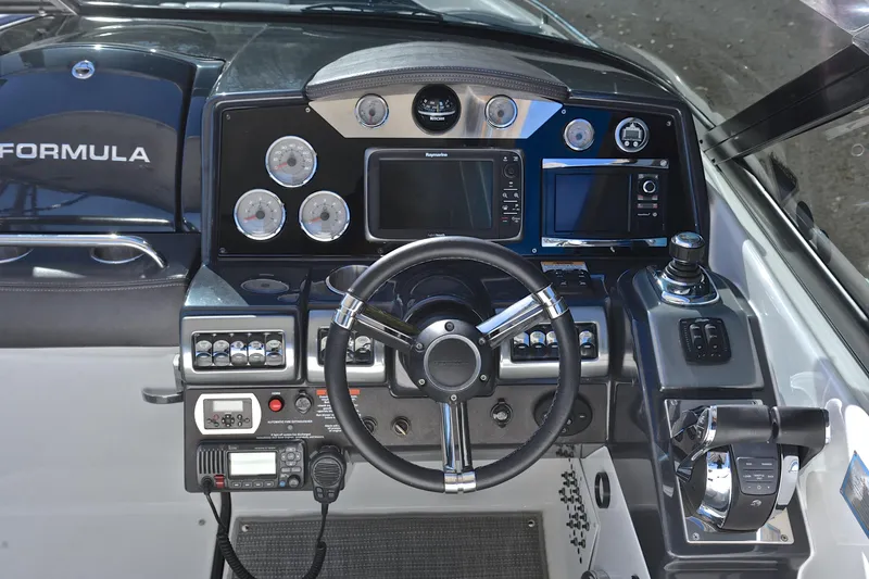 Slide: The Image of 2016 Formula 350 Crossover Bowrider dashboard with steering wheel and navigation controls. - 30