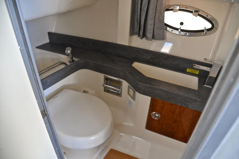 Slide: The Image of 2016 Formula 350 Crossover Bowrider bathroom with modern fixtures and compact design. - 34