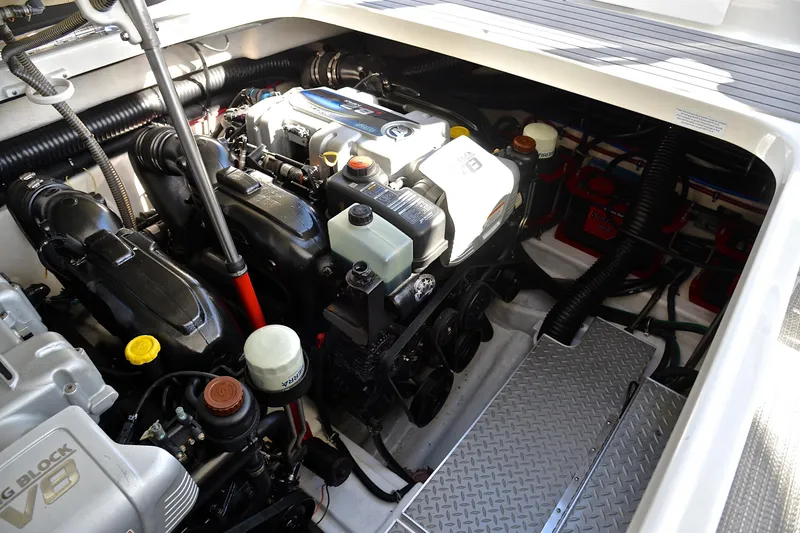 Slide: The Image of Engine compartment of a 2016 Formula 350 Crossover Bowrider boat, showcasing mechanical components. - 37