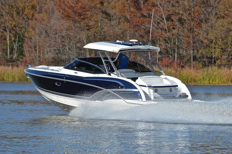 Slide: The Image of 2016 Formula 350 Crossover Bowrider cruising on a lake with autumn trees in background. - 4