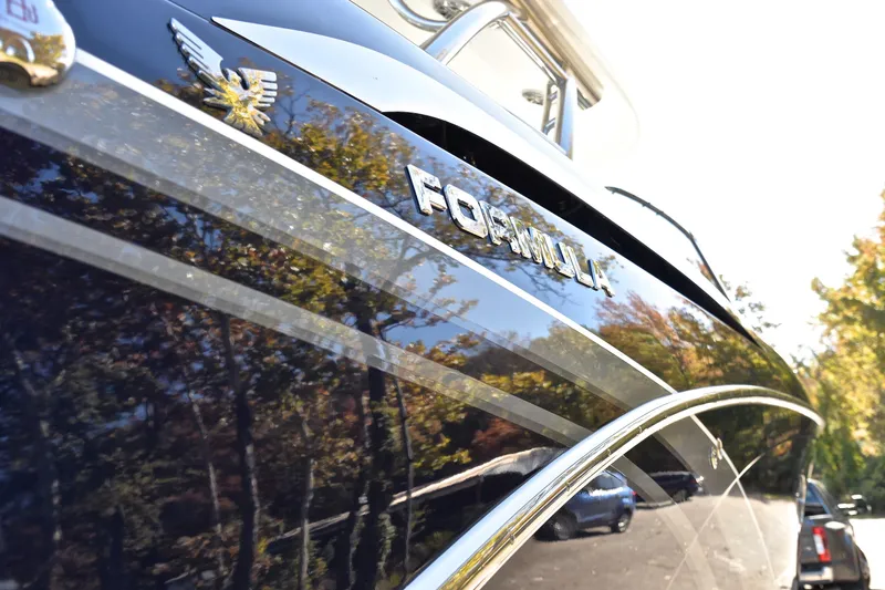 Slide: The Image of 2016 Formula 350 Crossover Bowrider boat with sleek design and reflective finish. - 42