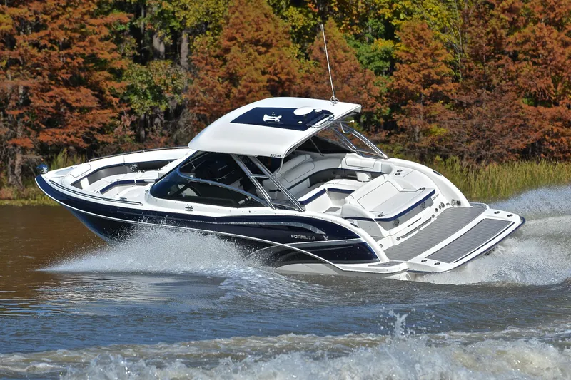 Slide: The Image of 2016 Formula 350 Crossover Bowrider cruising on a lake with autumn foliage. - 48