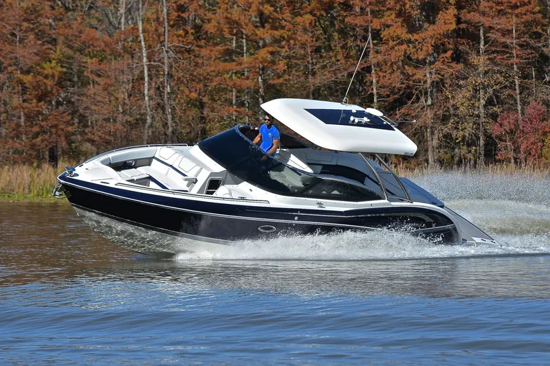 Slide: The Image of 2016 Formula 350 Crossover Bowrider cruising on a lake with autumn trees. - 49