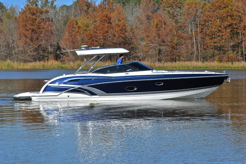 Slide: The Image of 2016 Formula 350 Crossover Bowrider on a serene lake with autumn trees. - 5