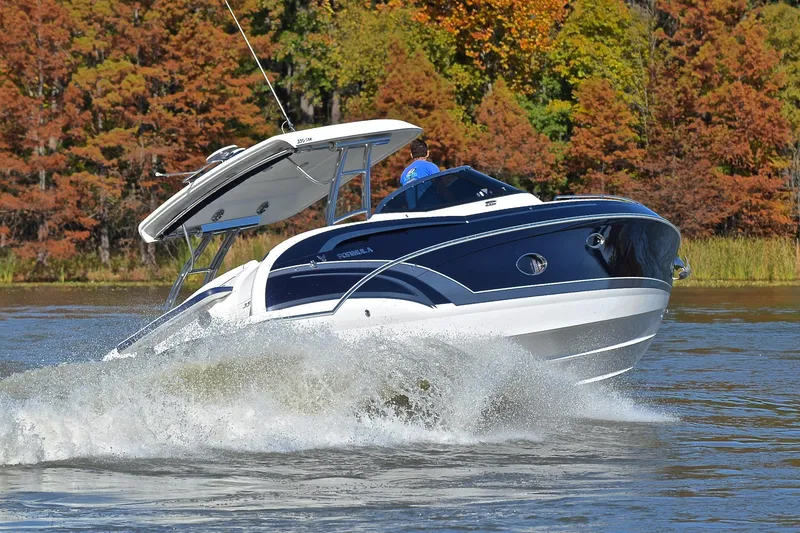 Slide: The Image of 2016 Formula 350 Crossover Bowrider cruising on a lake with autumn foliage backdrop. - 51