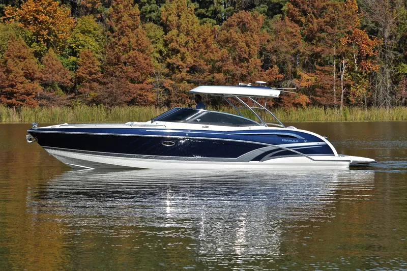 Slide: The Image of 2016 Formula 350 Crossover Bowrider on a serene lake with autumn trees. - 6