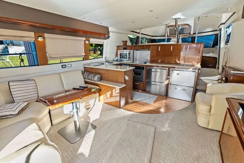 Slide: The Image of Luxurious interior of 2009 Carver 56 Voyager SE yacht with modern kitchen and seating area. - 14