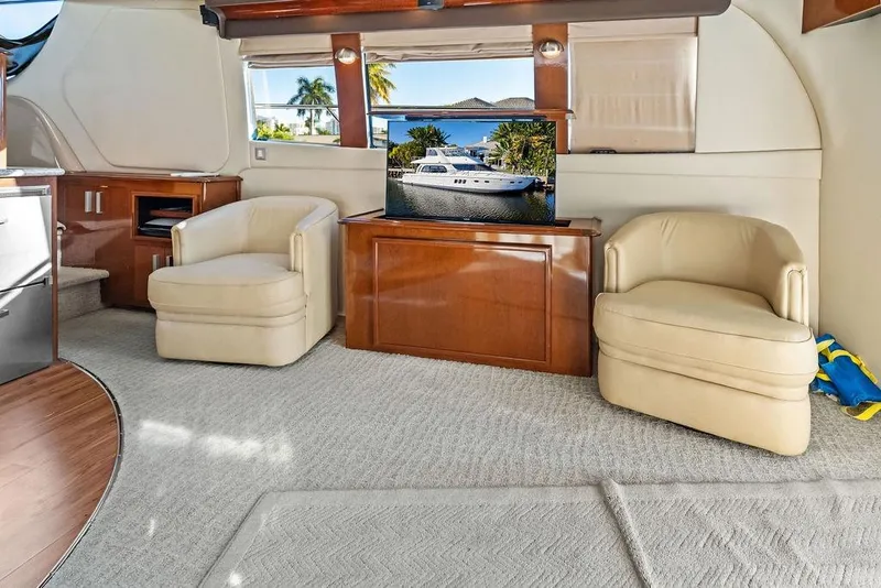 Slide: The Image of Luxurious interior of 2009 Carver 56 Voyager SE yacht with plush seating and elegant decor. - 16