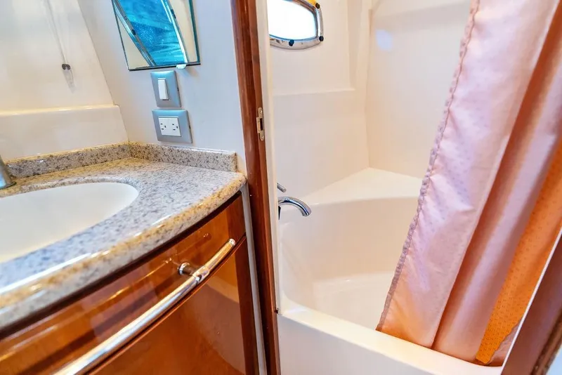 Slide: The Image of Luxurious bathroom in 2009 Carver 56 Voyager SE yacht with granite countertop. - 30