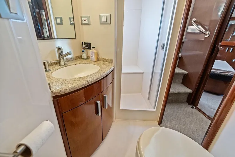 Slide: The Image of Luxurious bathroom in 2009 Carver 56 Voyager SE yacht with granite countertop and shower. - 33