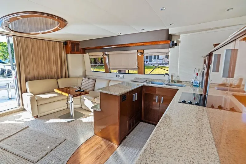 Slide: The Image of Luxurious interior of 2009 Carver 56 Voyager SE yacht with modern kitchen and seating area. - 18