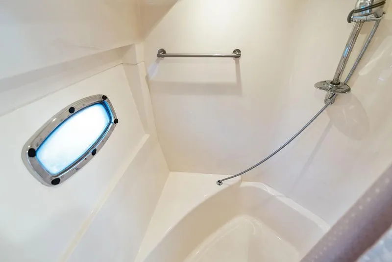 Slide: The Image of Bathroom interior of 2009 Carver 56 Voyager SE yacht with shower and porthole. - 31